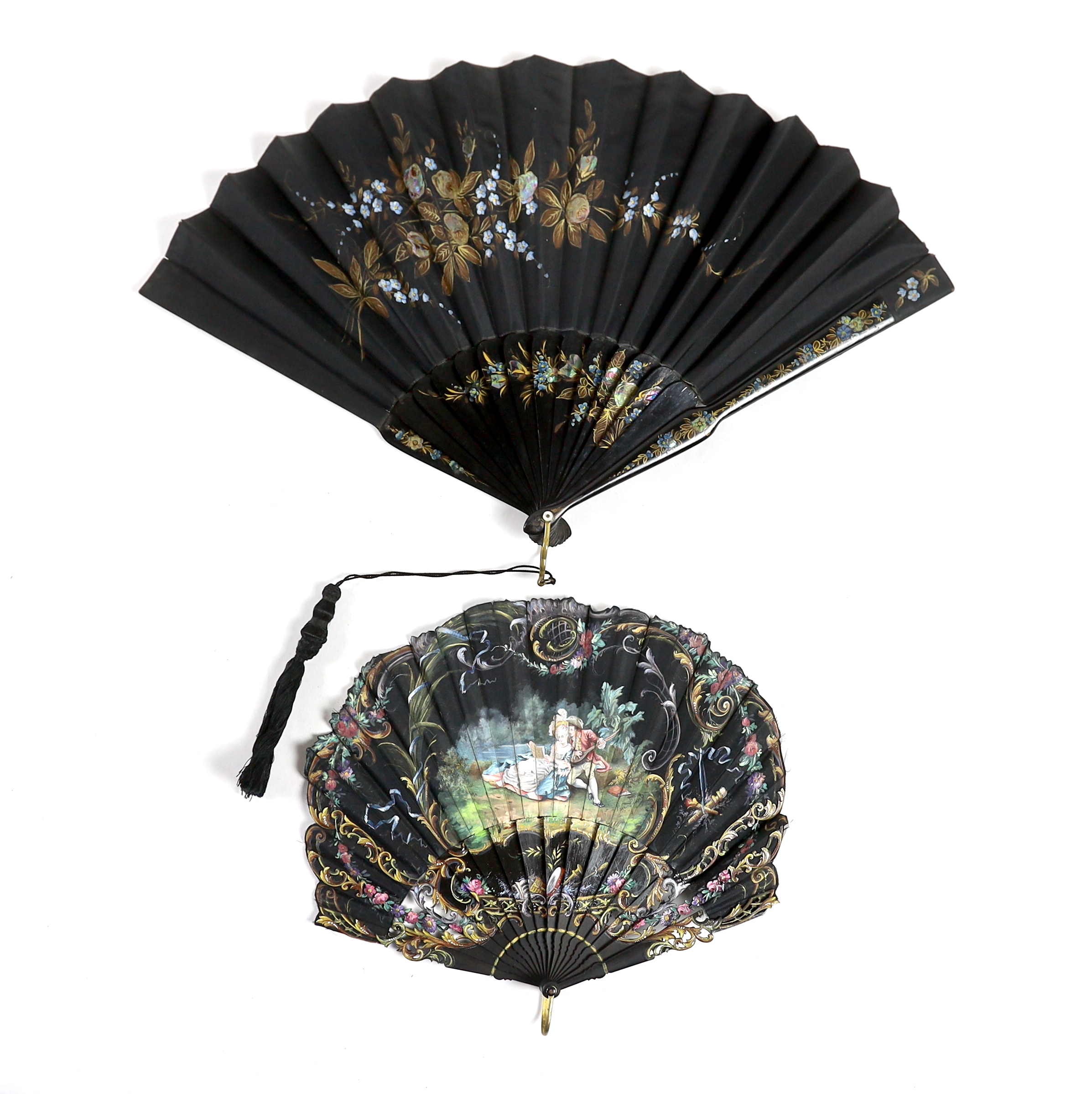 A late 19th century hand painted shaped and carved figurative fan, signed, together with a lacquer and mother of pearl fan, with matching leaf and guard decoration